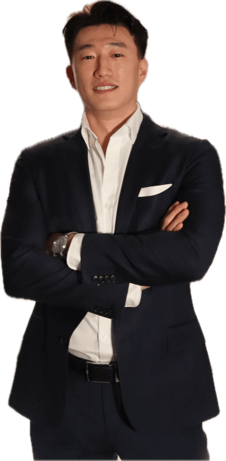 Youngjin Koh, arms crossed, in a navy suit